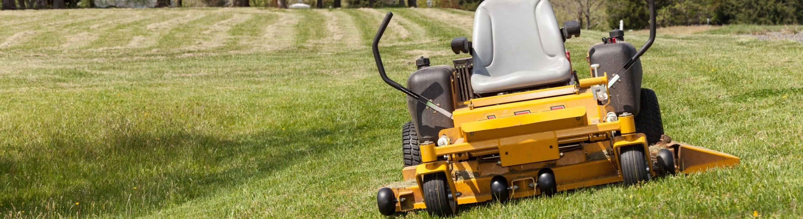 yellow lawn mower on grass