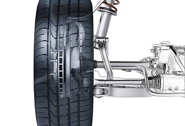 side view of automotive suspension and wheel on a white background